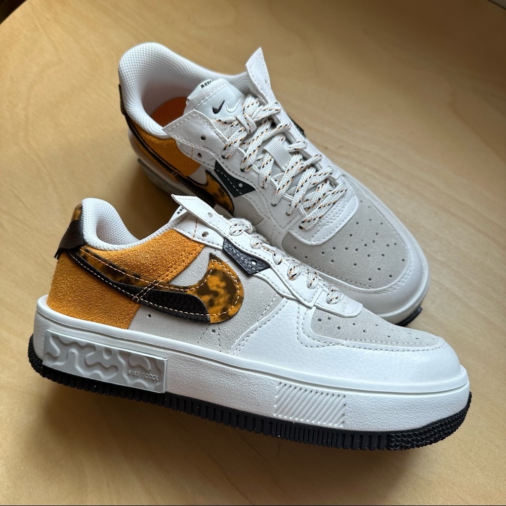Nike Women's Low-Top Sneakers in White, Yellow & Black Tortoise